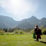 Rose Loven of Marysville takes a stroll in the grass at the Big Four Ice Caves Picnic Area off the Mountain Loop Highway. (Daniella Beccaria / Herald file)