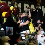 A couple kisses after an engagement during the game against the Chicago Sky at Angel of the Winds Arena on Friday, Aug. 27, 2021 in Everett, Wash. (Olivia Vanni / The Herald)