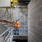 A worker disassembles a fluidized bed incinerator at the Edmonds Wastewater Treatment Plant last Thursday in Edmonds. (Olivia Vanni / The Herald)