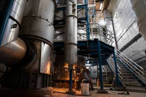 A worker disassembles a fluidized bed incinerator at the Edmonds Wastewater Treatment Plant on Thursday, Sept. 16, 2021 in Edmonds, Wa. (Olivia Vanni / The Herald)