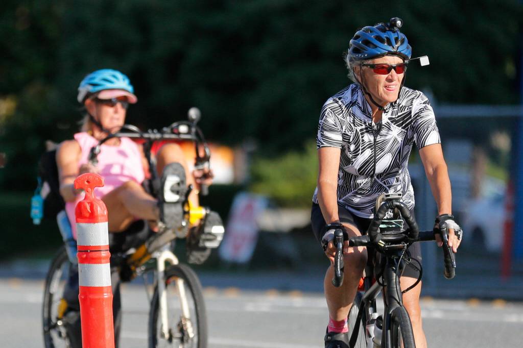 Brenda Mueller (left) and Lynn Salvo arrive at the Everett United Church of Christ. (Kevin Clark / The Herald)