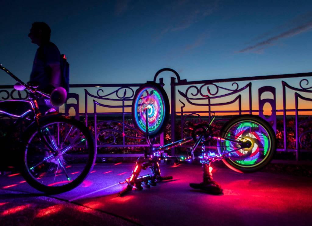 Lights make a colorful design Saturday as they spin on the spokes of Joseph Heiners bike in Everett. (Olivia Vanni / The Herald)