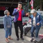 Danny Vernon, Illusion of Elvis Presley tribute impersonator, twirls Celia Salinas as her sister Rosa Cantu, left, waits to dance with Vernon as he performs at the Evergreen State Fair on Monday, Aug. 30, 2021 in Monroe, Washington.  (Andy Bronson / The Herald)