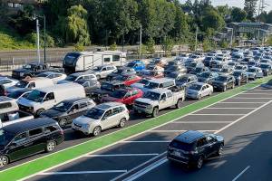 Cars line up waiting to board the ferry from Mukilteo to Clinton on July 28. (Sue Misao / Herald file)