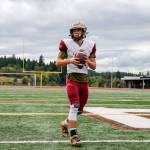 Justice Taylor drops back to pass during practice Tuesday afternoon at Lakewood High School in Arlington. (Kevin Clark / The Herald)