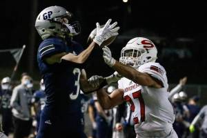 Glacier Peaks Ashton Olson makes a touchdown reception with Snohomishs Makai Williams defending at Veterans Memorial Stadium Friday night in Snohomish on March 12, 2021. (Kevin Clark / The Herald)