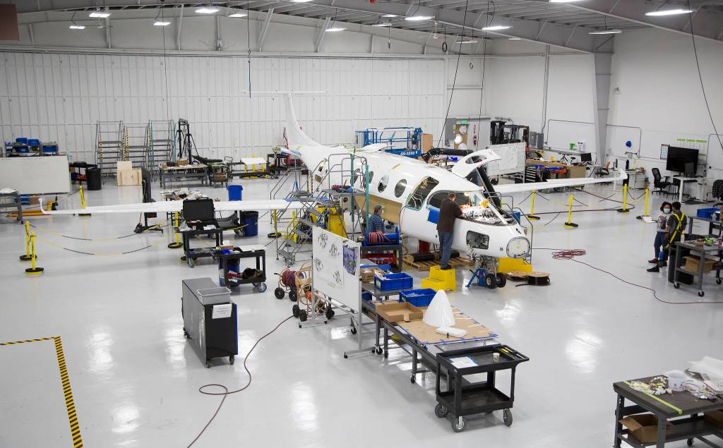 Workers build the first all-electric commuter plane, the Eviation Alice, on Sept. 8 in Arlington. The plane is designed for regional travel and to carry nine passengers. (Andy Bronson / The Herald)