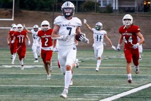 Glacier Peak's Logan Szarzec outruns the Snohomish defense for a touchdown at the top of the second quarter Friday night at Veteran's Memorial Stadium in Snohomish September 3, 2021. (Kevin Clark / The Herald)