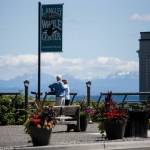 A couple gazes out to Saratoga Passage from Boy and Dog Park in Langley. The park is named for a sculpture by Whidbey Island artist Georgia Gerber. (Olivia Vanni / The Herald)