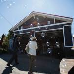 As a bubble machine does its thing, customers walk into Callahans Firehouse, a glass-blowing studio, in Langley. (Olivia Vanni / The Herald)