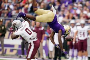 Montana's Omar Hicks Onu (0) upends and breaks up a pass intended for Washington's Giles Jackson in the first half of an NCAA college football game Saturday, Sept. 4, 2021, in Seattle. (AP Photo/Elaine Thompson)