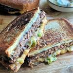 This vegetarian take on a patty melt is made with Impossible burger and a chipotle-spiked mayo with quick-charred scallions (Gretchen McKay / Post-Gazette)