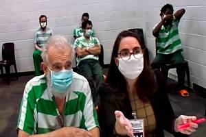 Lloyd Richmond (left) and attorney Samantha Sommerman appear at an Everett District Court bail hearing Monday. (Herald staff) 20210907