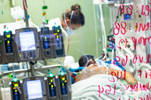 FILE - In this Aug. 31, 2021, file photo, Ann Enderle R.N. checks on a COVID-19 patient in the Medical Intensive care unit (MICU) at St. Luke's Boise Medical Center in Boise, Idaho. Idaho public health leaders have activated "crisis standards of care" for the state's northern hospitals because there are more coronavirus patients than the institutions can handle. The Idaho Department of Health and Welfare made the announcement Tuesday, Sept. 7.  (AP Photo/Kyle Green, File)