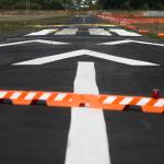 Its business as usual in spite of construction starting on the Harvey Airfield runway on Thursday, Sept. 9, 2021 in Snohomish, Washington.  Planes use the grass/dirt runway as the asphalt runway gets a new facelift. (Andy Bronson / The Herald)