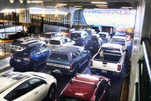 Cars ride the Walla Walla ferry from Seattle to Bremerton on Aug. 4. (Sue Misao / The Herald)
