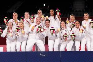 Lake Stevens High School graduate Katie Holloway (top row, third from left) and the rest of the United States women's sitting volleyball team celebrate with their gold medals after defeating China in the final match at the 2020 Paralympic Games on Sept. 5, 2021, in Tokyo. (Photo provided by USA Volleyball)