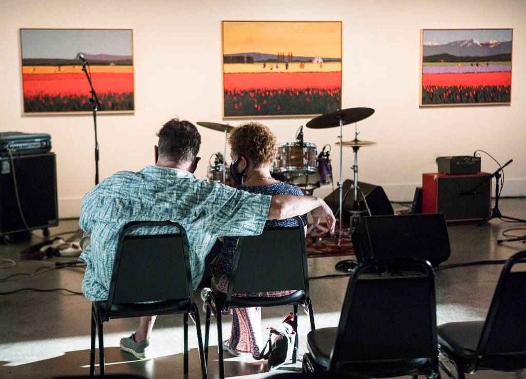 People wait for Sylvi to perform at the Schack Art Center during the first night of Fishermans Village Music Festival on Thursday in Everett. (Olivia Vanni / The Herald)