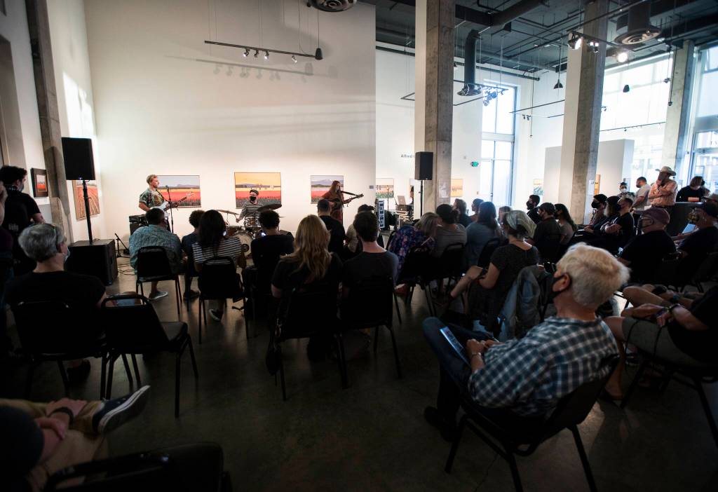 People gather inside the Schack Art Center during the first night of the Fishermans Village Music Festival to watch Sylvi perform. (Olivia Vanni / The Herald)