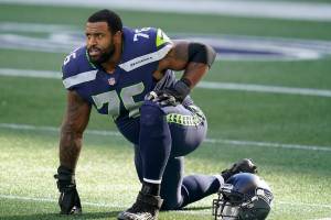 Seattle Seahawks offensive tackle Duane Brown stretches before an NFL football game against the San Francisco 49ers, Sunday, Nov. 1, 2020, in Seattle. (AP Photo/Elaine Thompson)