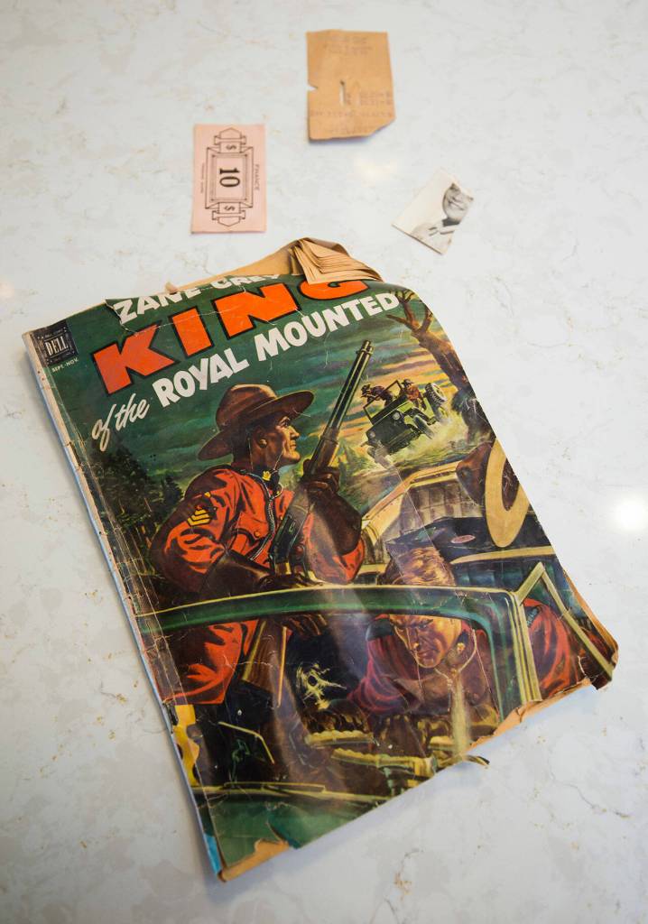 The Poischbegs found these items in a wall of their 1950 home during a remodel. (Andy Bronson / The Herald)