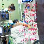 Registered nurse Ann Enderle checks on a covid-19 patient in the Medical Intensive care unit (MICU) at St. Lukes Boise Medical Center in Boise, Idaho, Aug. 31. Idaho public health leaders have activated crisis standards of care for the states northern hospitals because there are more coronavirus patients than the institutions can handle. The Idaho Department of Health and Welfare made the announcement Tuesday, Sept. 7. (Kyle Green / Associated Press)
