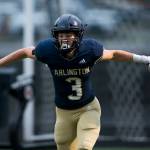 Arlingtons Gage Price celebrates after scoring a touchdown during the game against Oak Harbor on Friday, Sept. 10, 2021 in Arlington, Wa. (Olivia Vanni / The Herald)