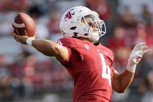 Washington State quarterback Jayden de Laura throws a pass during the second half of an NCAA college football game against Portland State, Saturday, Sept. 11, 2021, in Pullman, Wash. (AP Photo/Young Kwak)