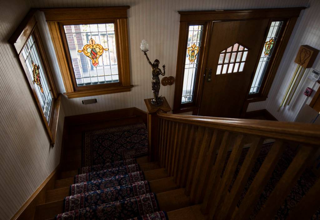 A bronze fixture stands on the end of the banister leading up to the second floor of the Van Valey House on Wednesday in Everett. (Olivia Vanni / The Herald)