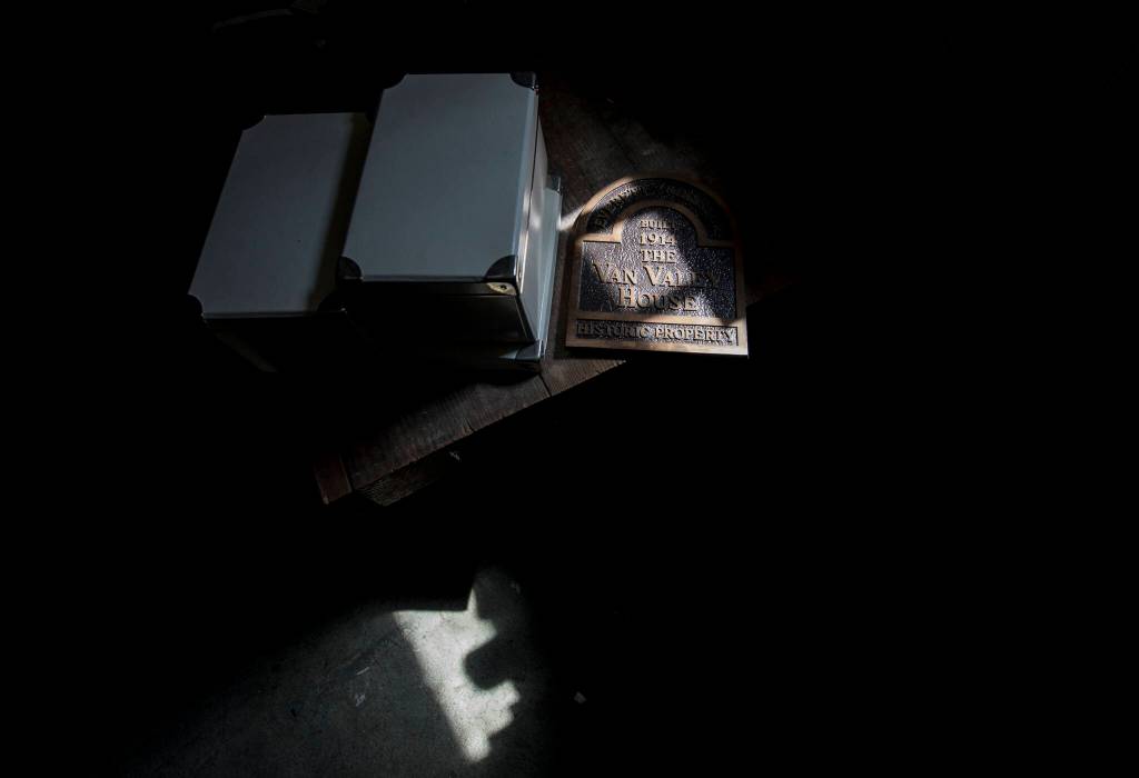 A historic property plate sits in the basement of the Van Valey House on Wednesday in Everett. (Olivia Vanni / The Herald)