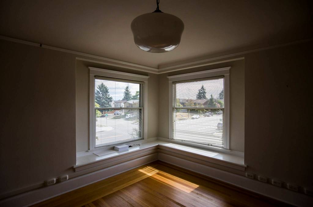 Windows from the second floor of the Van Valey House look out onto Colby Avenue on Wednesday in Everett. (Olivia Vanni / The Herald)