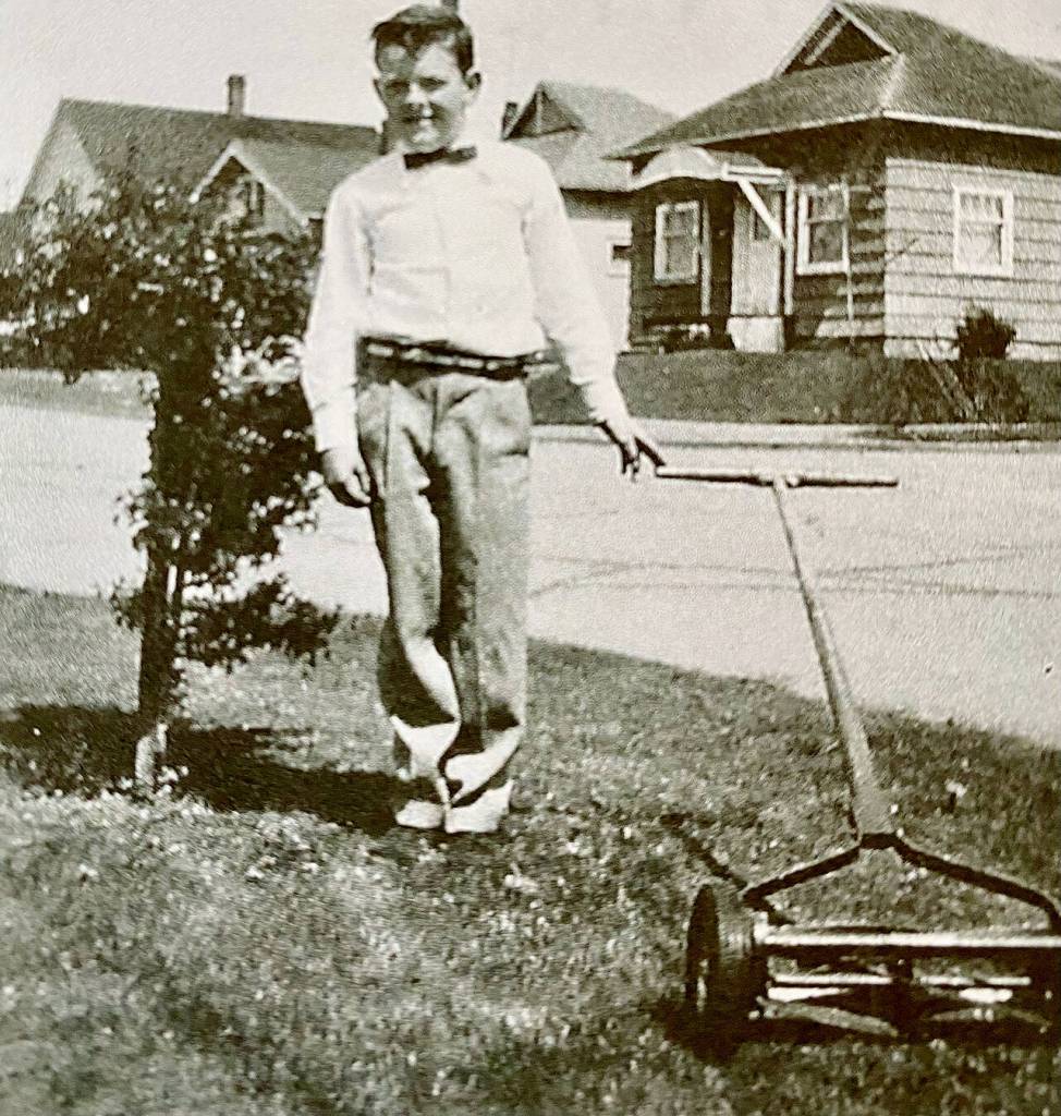 David Boushey as the bow-tied mower of lawns as a child in Everett.