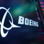 FILE - The logo for Boeing appears on a screen above a trading post on the floor of the New York Stock Exchange, Tuesday, July 13, 2021. Despite the pandemic's damage to air travel, Boeing says it's optimistic about long-term demand for airplanes. Boeing said Tuesday, Sept. 14, 2021 that it expects the aerospace market to be worth $9 trillion over the next decade. That includes planes for airlines and military uses and other aerospace products and services. (AP Photo/Richard Drew, file)