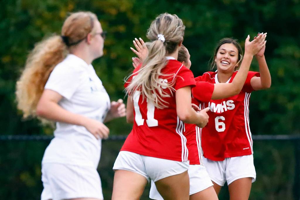 The Wildcats celebrate a goal in the first half of play at Archbishop Murphy High School Tuesday night in Everett on September 14, 2021. The Wildcats won 6-1. (Kevin Clark / The Herald)