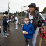Marte poses for a photo with fan Rowan Rice before Tuesdays game at Funko Field. (Andy Bronson / The Herald)