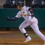 The AquaSox' Noelvi Marte hits a double against the Spokane Indians at Funko Field on Tuesday, Sept. 14, 2021 in Everett, Washington. The Mariners promoted Marte from Low-A Modesto to High-A Everett on Monday. (Andy Bronson / The Herald)