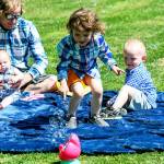 Erik Denton (left) holds his youngest daughter, Sierra, while his daughter Joanna chases bubbles and son Terry watches. Dentons three children were killed in April. (Contributed photo)