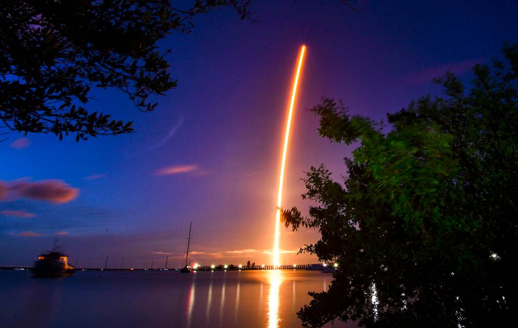The launch of a SpaceX Crew Dragon capsule atop a Falcon 9 rocket is seen after taking off from Pad 39A at Kennedy Space Center in Cape Canaveral, Florida, on Wednesday. (Florida Today via AP)