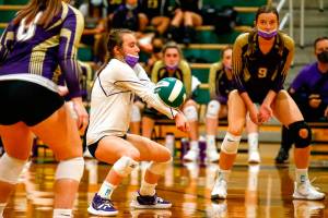 Lake Stevens' Kennedy Steen digs against Lake Stevens' Tuesday night at Edmonds-Woodway High School in Edmonds on September 7, 2021. The Vikings won in straight sets. (Kevin Clark / The Herald)