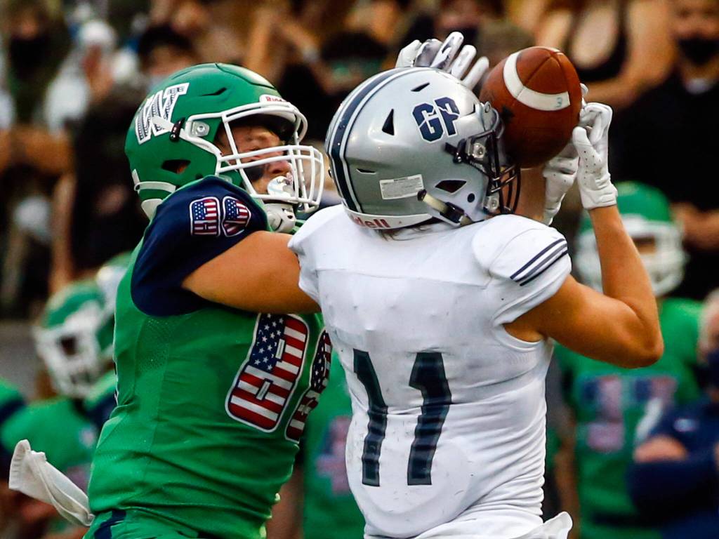 Glacier Peaks Jadon Claps intercepts a pass intended for Woodinvilles Bo Graham Thursday evening at Pop Keeney Stadium in Bothell on September 16, 2021. (Kevin Clark / The Herald)