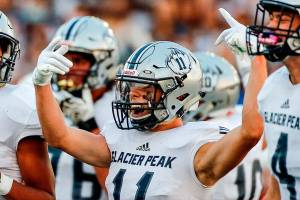 Glacier Peak's Jadon Claps celebrates a defensive stop against Snohomish Friday night at Veteran's Memorial Stadium in Snohomish September 3, 2021. (Kevin Clark / The Herald)