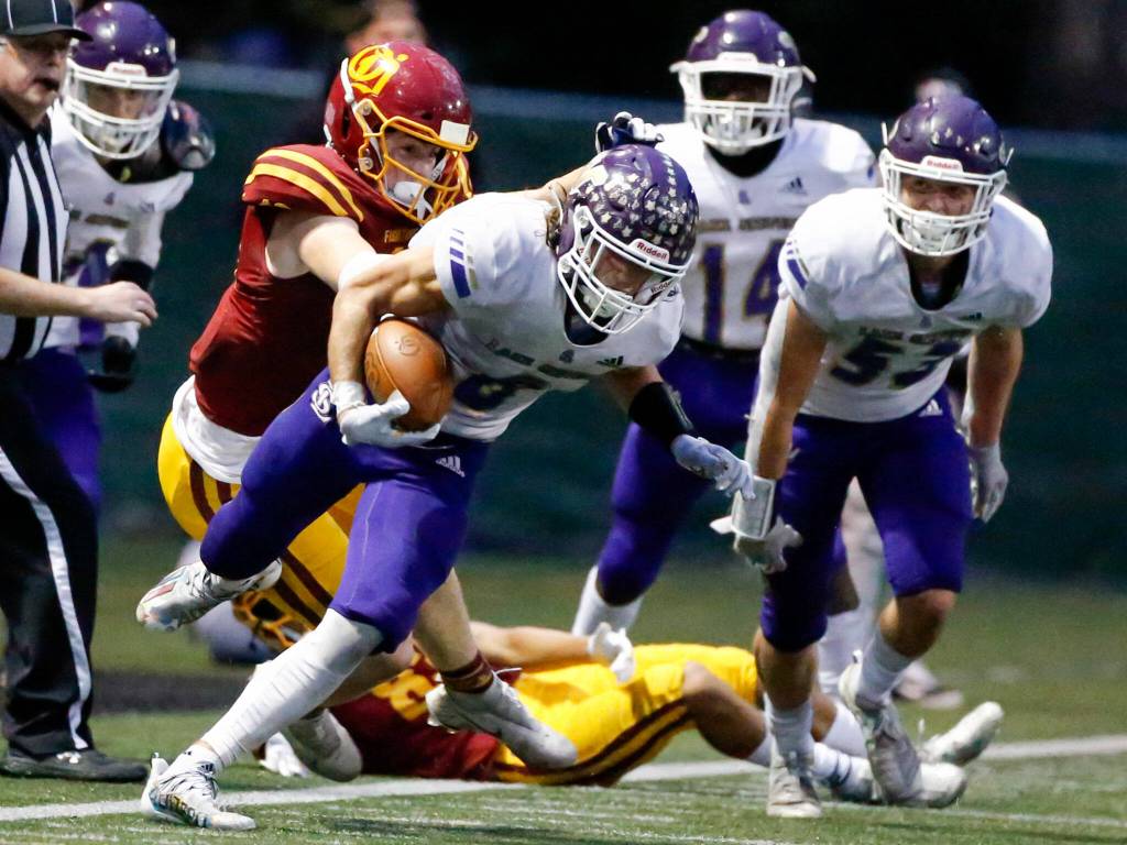 Lake Stevens Drew Carter returns a fumble late the fourth quarter Friday at Memorial Stadium in Seattle on September 17, 2021. The Vikings defeated the Irish, 20-3. (Kevin Clark / The Herald)