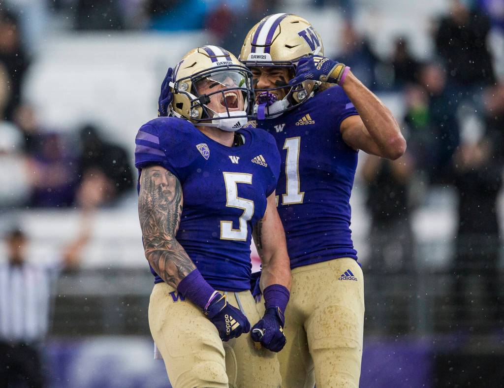Washington Huskies running back Sean McGrew celebrates his touchdown during the game against Arkansas State on Saturday, Sept. 18, 2021 in Seattle, Wa. (Olivia Vanni / The Herald)