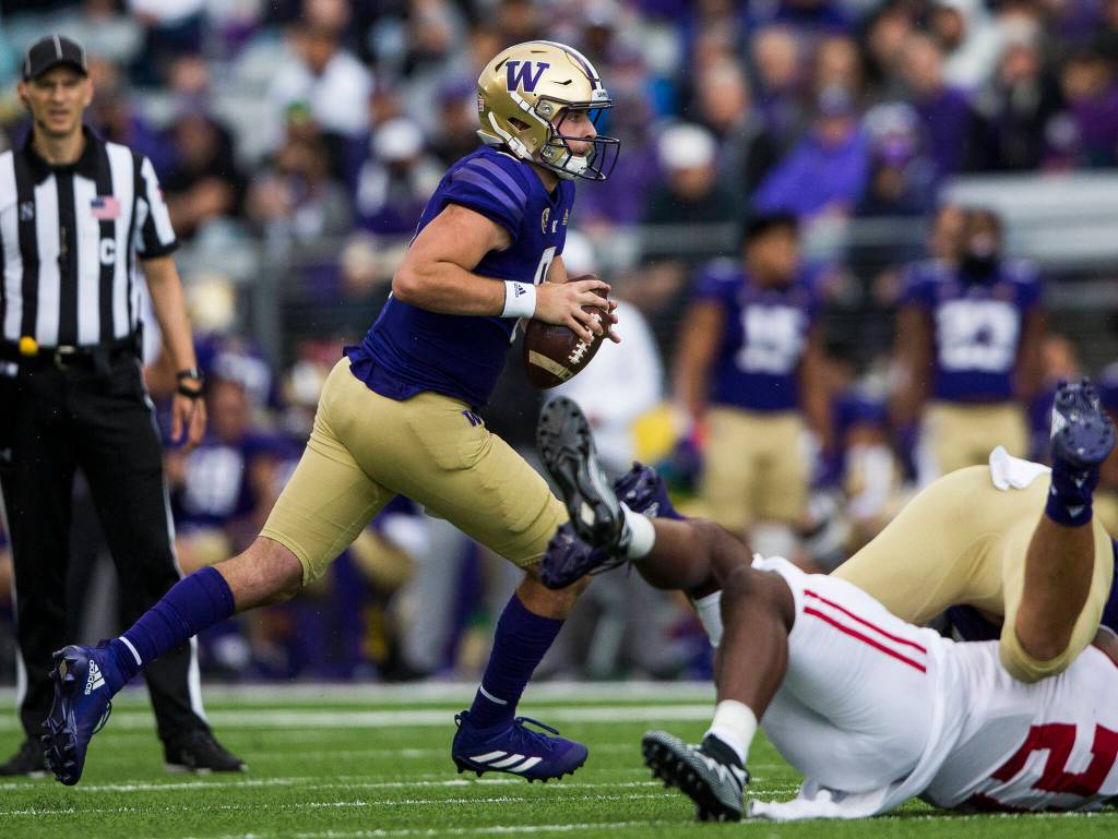 Washington Huskies quarterback Dylan Morris runs with the ball during the game against Arkansas State on Saturday, Sept. 18, 2021 in Seattle, Wa. (Olivia Vanni / The Herald)