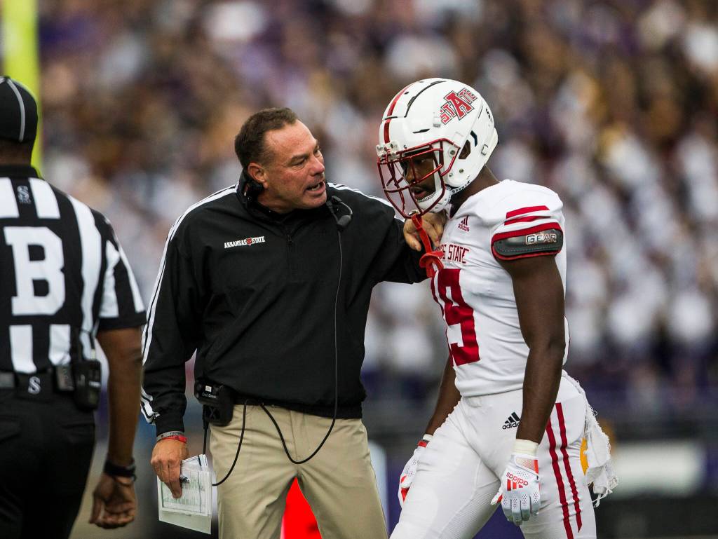 An Arkansas State coach yells at an Arkansas player during the game on Saturday, Sept. 18, 2021 in Seattle, Wa. (Olivia Vanni / The Herald)
