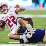 Arkansas States Lincoln Pare is tackled during the game on Saturday, Sept. 18, 2021 in Seattle, Wa. (Olivia Vanni / The Herald)