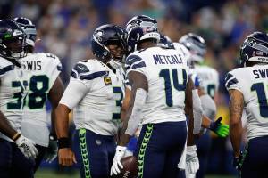 Seattle Seahawks quarterback Russell Wilson (3) celebrates with wide receiver DK Metcalf (14) after a touchdown against the Indianapolis Colts during an NFL football game in Indianapolis, Sunday, Sept. 12, 2021. (Jeff Haynes/AP Images for Panini)
