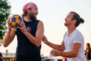 Bill Johnson, left, looks to pass with Sean Hermis defending while playing korfball Thursday evening at Mukilteo Beach on September 9, 2021. (Kevin Clark / The Herald)