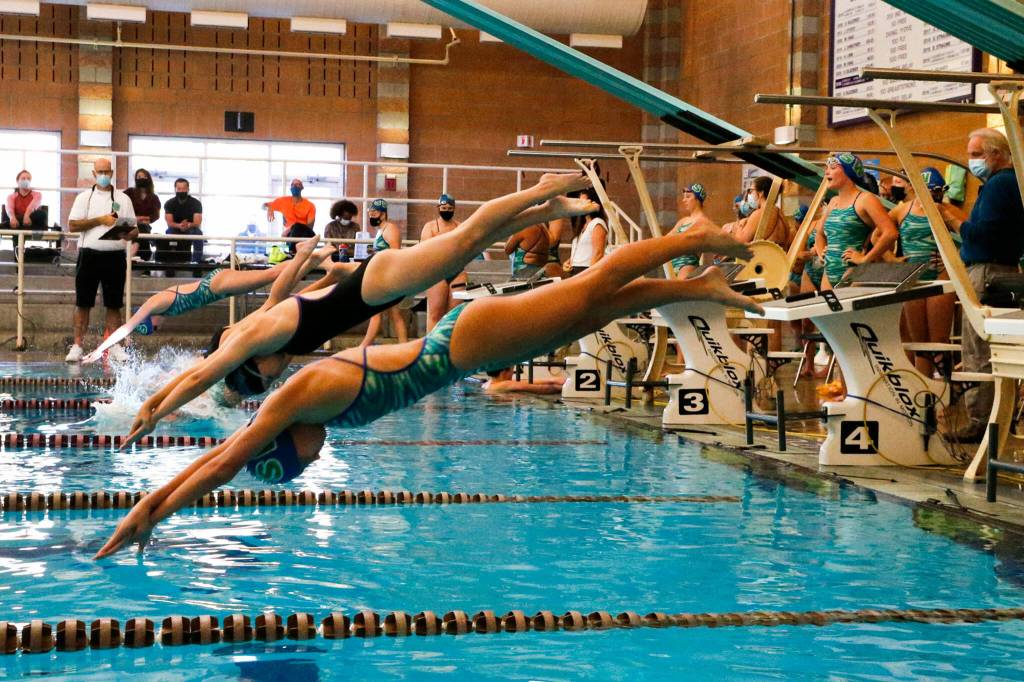 The start of the 400 yard freestyle relay Tuesday afternoon at Kamiak High School in Mukilteo on September 21, 2021. (Kevin Clark / The Herald)