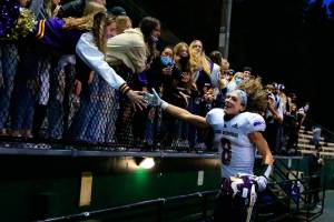 Lake Stevens' Drew Carter celebrates with the fans Friday at Memorial Stadium in Seattle on September 17, 2021. The Vikings defeated the Irish, 20-3. (Kevin Clark / The Herald)
